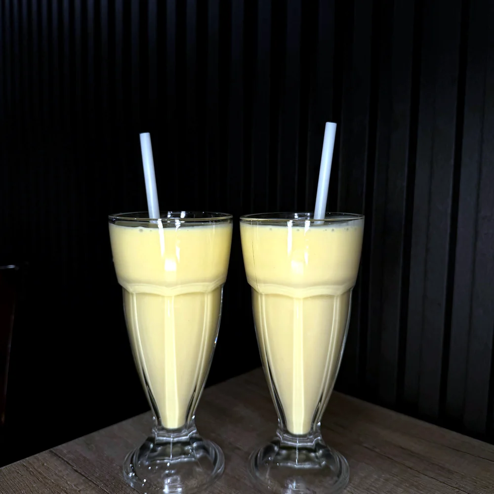 Two glasses of mango lassi