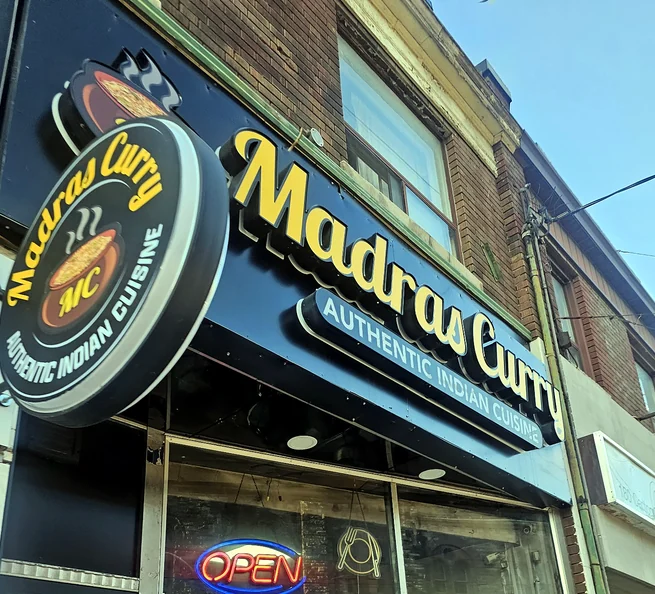Madras Curry storefront sign on Carlton Street